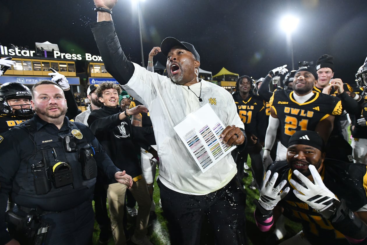 Kennesaw State head coach Jerry Mack celebrates with players after Kennesaw State beat UTEP during an NCAA college football game at Fifth Third Stadium, Tuesday, October 28, 2025 in Kennesaw. Kennesaw State won 33-20 over University of Texas at El Paso. (Hyosub Shin / AJC)