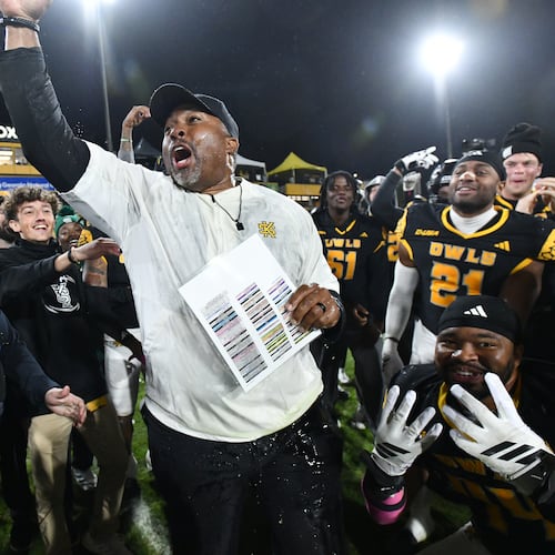 Kennesaw State head coach Jerry Mack celebrates with players after Kennesaw State beat UTEP during an NCAA college football game at Fifth Third Stadium, Tuesday, October 28, 2025 in Kennesaw. Kennesaw State won 33-20 over University of Texas at El Paso. (Hyosub Shin / AJC)
