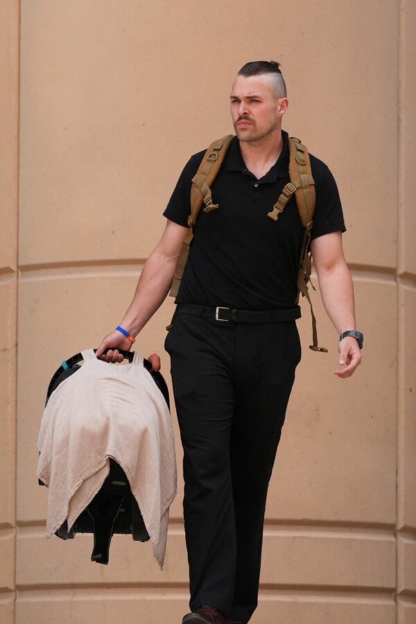 Colby Ryan leaves Maricopa County Superior Court for the murder trial of Lori Vallow Daybell, his mother, who is charged with conspiring to murder her estranged husband, Monday, April 21, 2025, in Phoenix. (AP Photo/Ross D. Franklin)