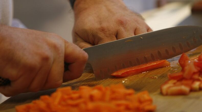Dicing and cooking tomatoes can help you get more bang for your nutritional buck. (Michael Tercha/Chicago Tribune/TNS)