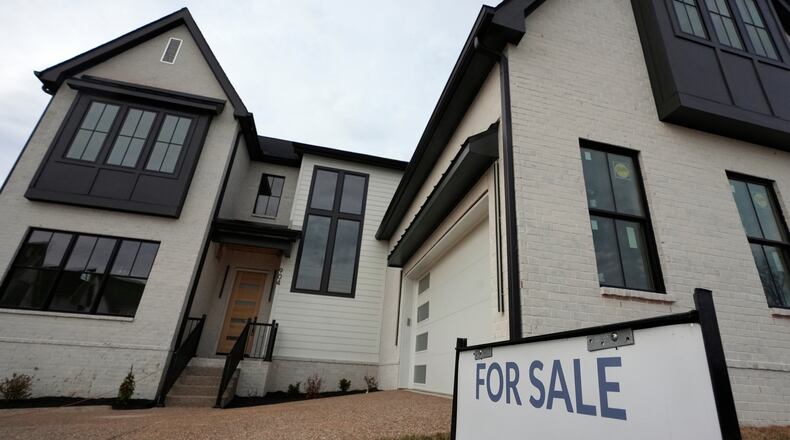 FILE - A for sale sign is posted outside a home, Feb. 10, 2026, in Nashville, Tenn. (AP Photo/George Walker IV, file)