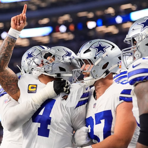 Dallas Cowboys quarterback Dak Prescott (4) celebrates his rushing touchdown during the second half of an NFL football game against the Philadelphia Eagles, Sunday, Nov. 23, 2025, in Arlington, Texas. (AP Photo/Tony Gutierrez)