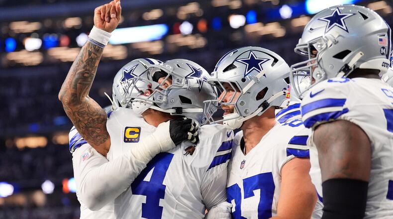 Dallas Cowboys quarterback Dak Prescott (4) celebrates his rushing touchdown during the second half of an NFL football game against the Philadelphia Eagles, Sunday, Nov. 23, 2025, in Arlington, Texas. (AP Photo/Tony Gutierrez)