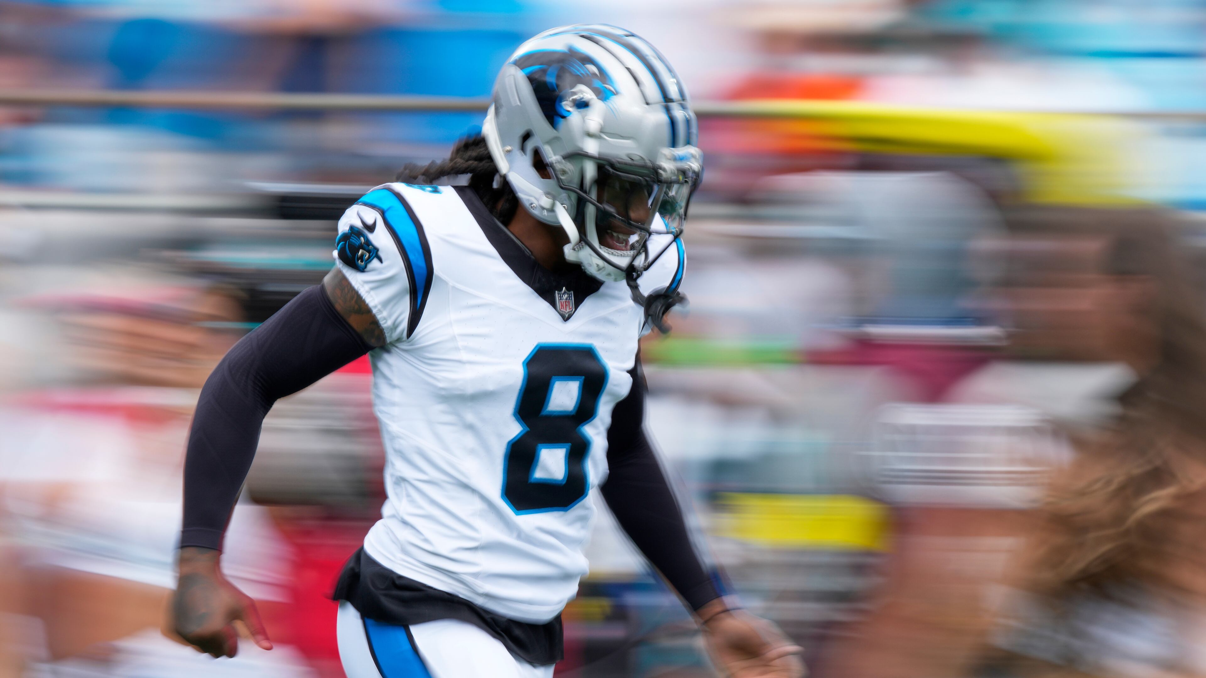 Carolina Panthers cornerback Jaycee Horn runs on to the field for an NFL football game between the Carolina Panthers and the Miami Dolphins, Sunday, Oct. 5, 2025, in Charlotte, N.C. (AP Photo/Jacob Kupferman)