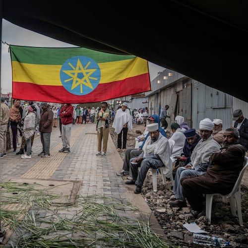Ethiopian voters gather outside a polling station before voting begins in the general election in Addis Ababa, Ethiopia, Monday, June 1, 2026. (AP Photo/Amanuel Sileshi)