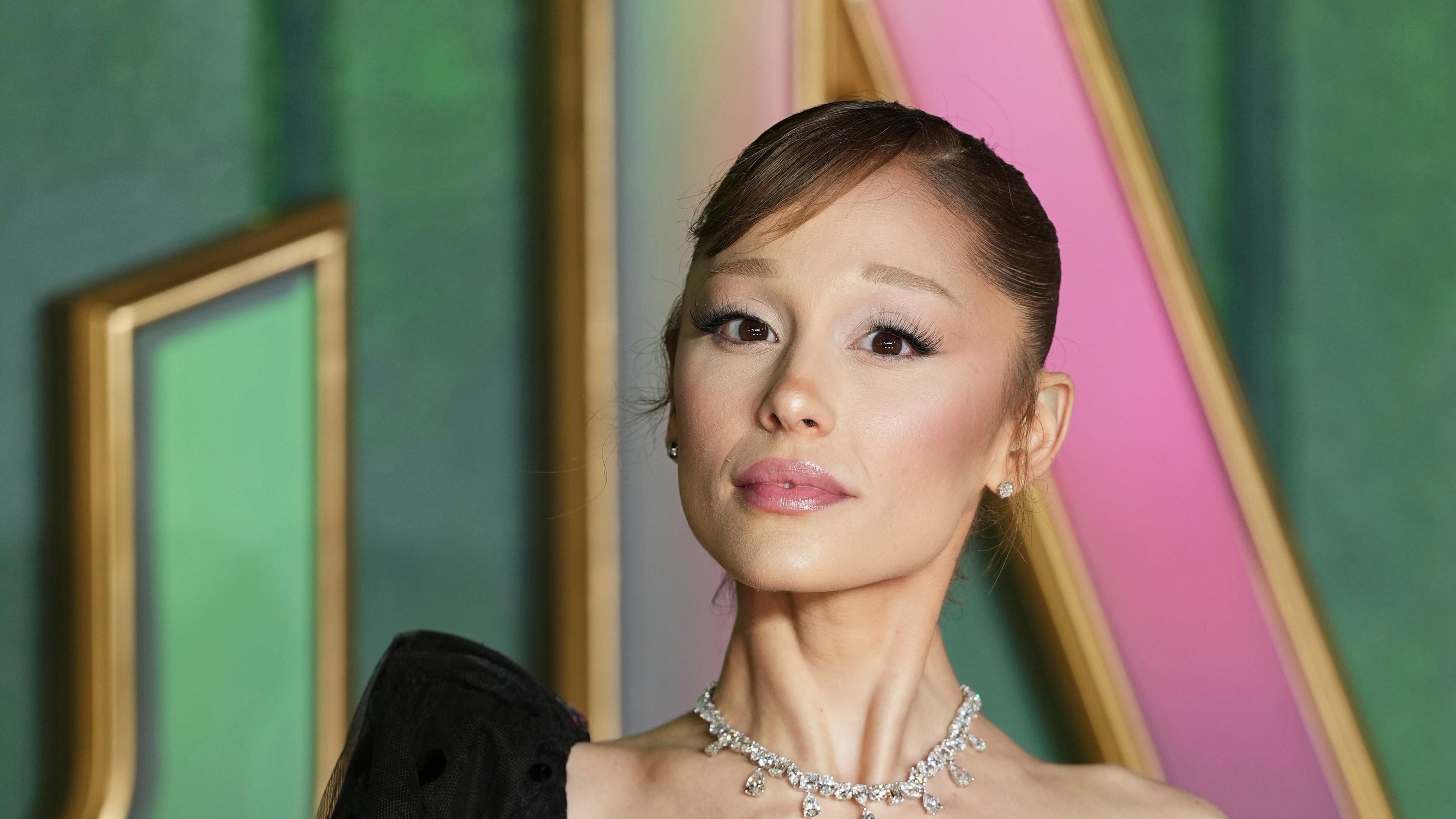 FILE - Ariana Grande poses for photographers upon arrival at the premiere of the film "Wicked For Good" in London, Nov. 10, 2025. (Photo by Scott A Garfitt/Invision/AP, File)