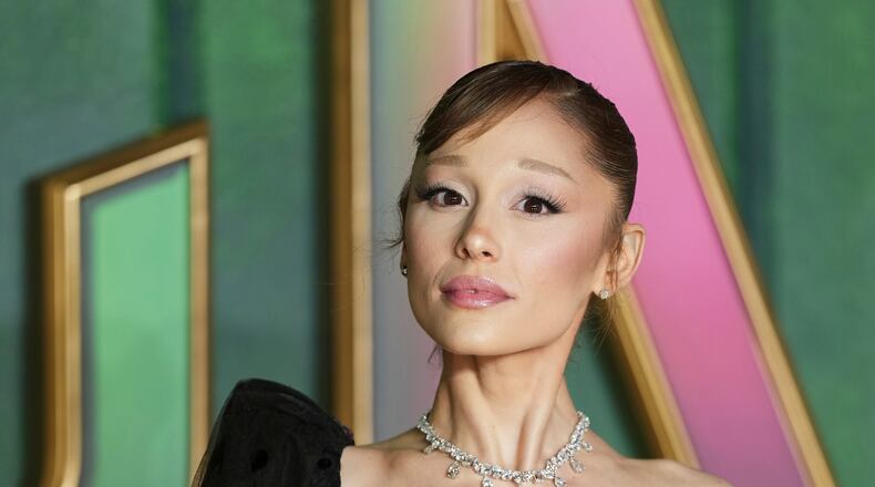 FILE - Ariana Grande poses for photographers upon arrival at the premiere of the film "Wicked For Good" in London, Nov. 10, 2025. (Photo by Scott A Garfitt/Invision/AP, File)