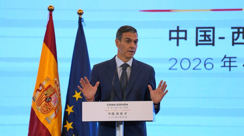 Spain's Prime Minister Pedro Sanchez gestures as he speaks during a press conference in Beijing, China, Tuesday, April 14, 2026. (AP Photo/Ng Han Guan)
