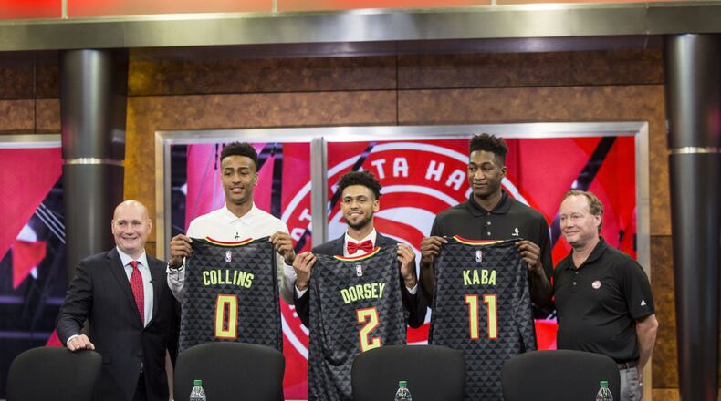 Atlanta Hawks general manager, Travis Schlenk (far left), and head coach Mike Budenholzer (far right), stand with 2017 draft picks John Collins (left), Tyler Dorsey (middle) and Alpha Kaba (right). Chad Rhym/ Chad.Rhym@ajc.com