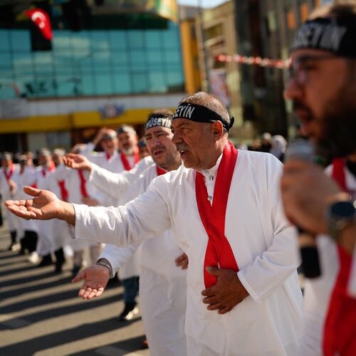 Shiite faithful Muslims attend an Ashoura procession which commemorates the 7th-century martyrdom of Imam Hussein in Istanbul, Turkey, Thursday, June 25, 2026. (AP Photo/Emrah Gurel)