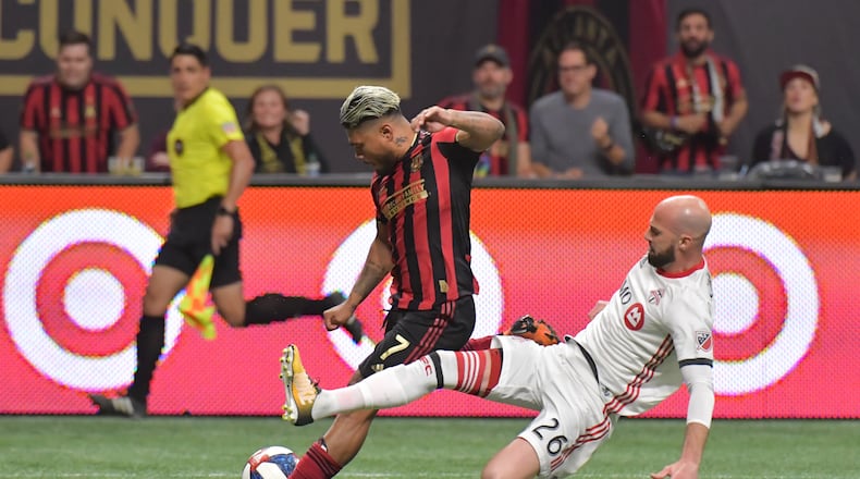October 30, 2019 Atlanta - Atlanta United forward Josef Martinez (7) takes a shot as Toronto FC defender Laurent Ciman (26) defends in the second half during the Eastern Conference Final soccer match at Mercedes-Benz Stadium on Wednesday, October 30, 2019. Toronto FC won 2-1 over the Atlanta United. (Hyosub Shin / Hyosub.Shin@ajc.com)