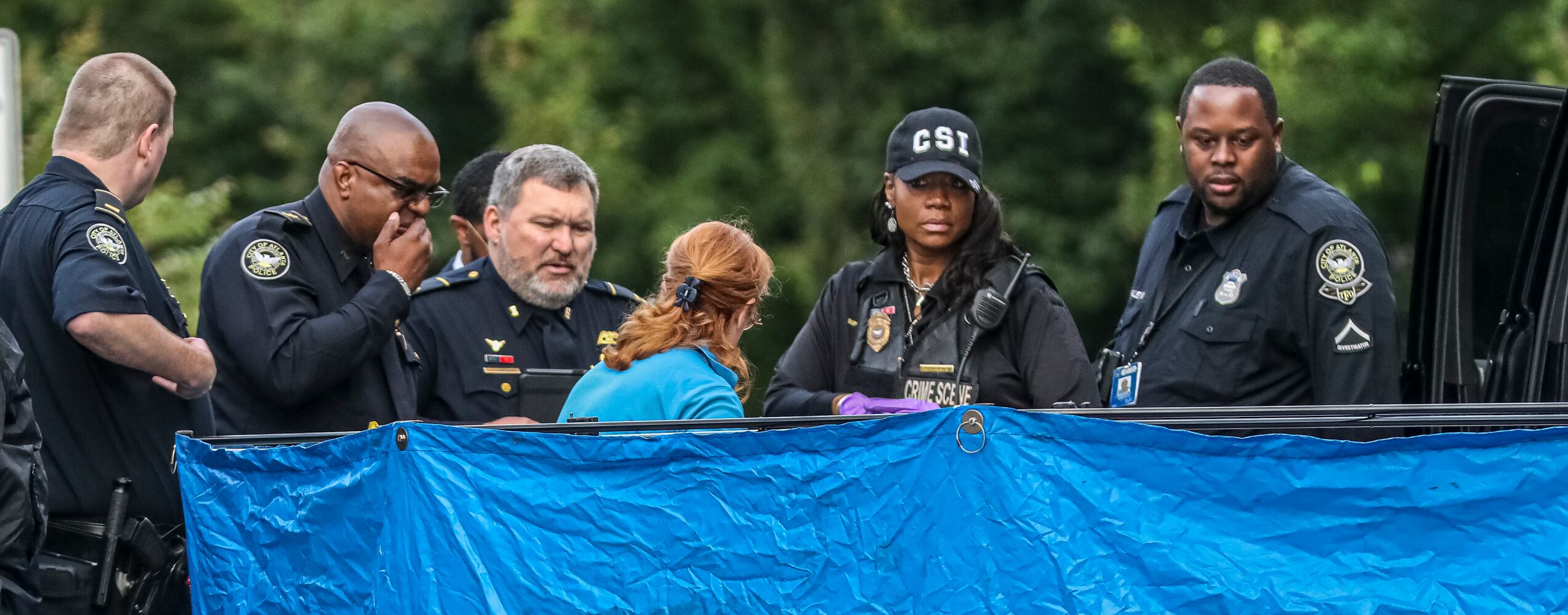A woman was gunned down Tuesday morning, May 30, 2023, during an Uber ride in Buckhead, according to Atlanta police. The incident happened near the intersection of Lindbergh and Adina drives shortly before 4:30 a.m., according to Deputy Chief Charles Hampton Jr. Police blocked the roads as they canvassed the area for evidence.  (John Spink / John.Spink@ajc.com)


