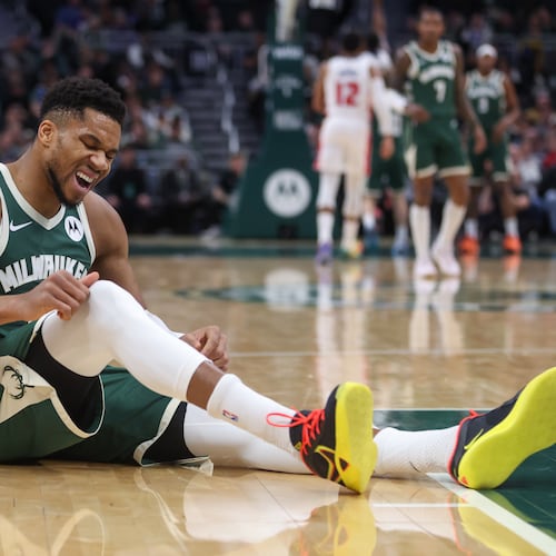 Milwaukee Bucks' Giannis Antetokounmpo reacts after suffering an injury during the first half an NBA basketball game against the Detroit Pistons, Wednesday, Dec. 3, 2025, in Milwaukee. (AP Photo/Kylie Bridenhagen)