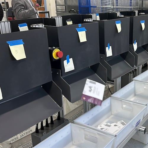 A sorting machine separates sample ballots into bins during a demonstration of voting equipment at the Montgomery County Board of Elections headquarters in Gaithersburg, Md., Thursday, Jan. 22, 2026. (AP Photo/Robert Yoon)