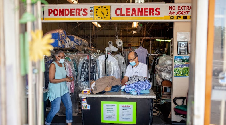 Ponder’s Cleaners owners Deborah Ponder (left) and her husband, Roderick Ponder, sort through clothing at their business in Atlanta on Saturday, June 13, 2020. (Photo: Branden Camp for The Atlanta Journal-Constitution)