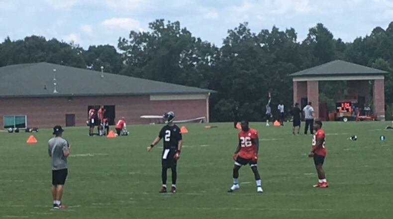 Quarterback Matt Ryan working out with running back Tevin Coleman. (By D. Orlando Ledbetter/dledbetter@ajc.com)