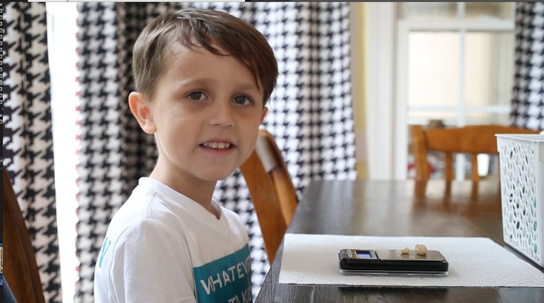 Six-year-old Elias Kroboth eats about 1.5 grams of peanuts as part of his daily Oral Immunotherapy treatment plan on Thursday, July 12, 2018 in Raleigh, N.C. After gradually increasing his consumption of peanuts, and passing a test with his doctor, Kroboth can consume peanut products freely.