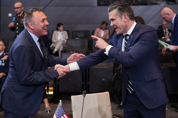 Defense Secretary Pete Hegseth, right, speaks with Norway's Defense Minister Tore Sandvik during a meeting of NATO defense ministers at NATO headquarters in Brussels, Thursday, June 5, 2025. (AP Photo/Virginia Mayo)
