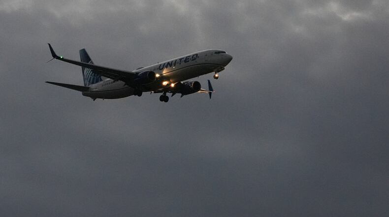 An United Airlines flight arrives at O'Hare International Airport in Chicago, Monday, Nov. 3, 2025. (AP Photo/Nam Y. Huh)