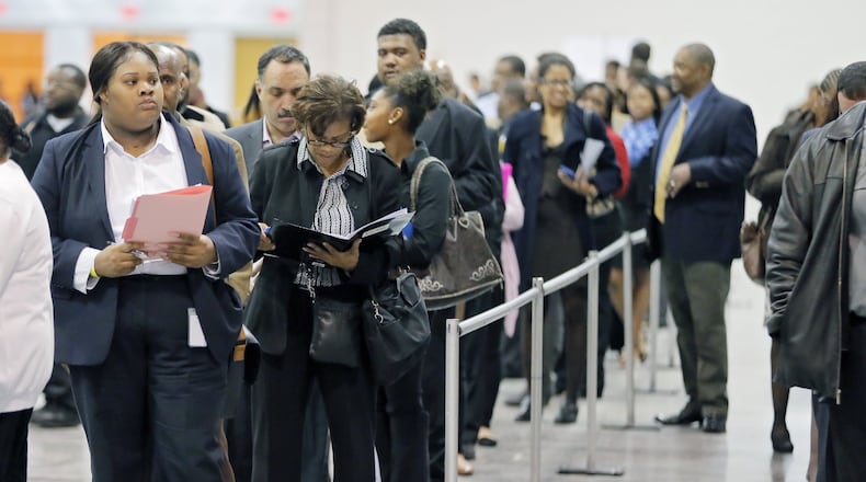 Pre-registered applicants line up for the opening of Hartsfield Jackson’s job fair Tuesday. BOB ANDRES /BANDRES@AJC.COM