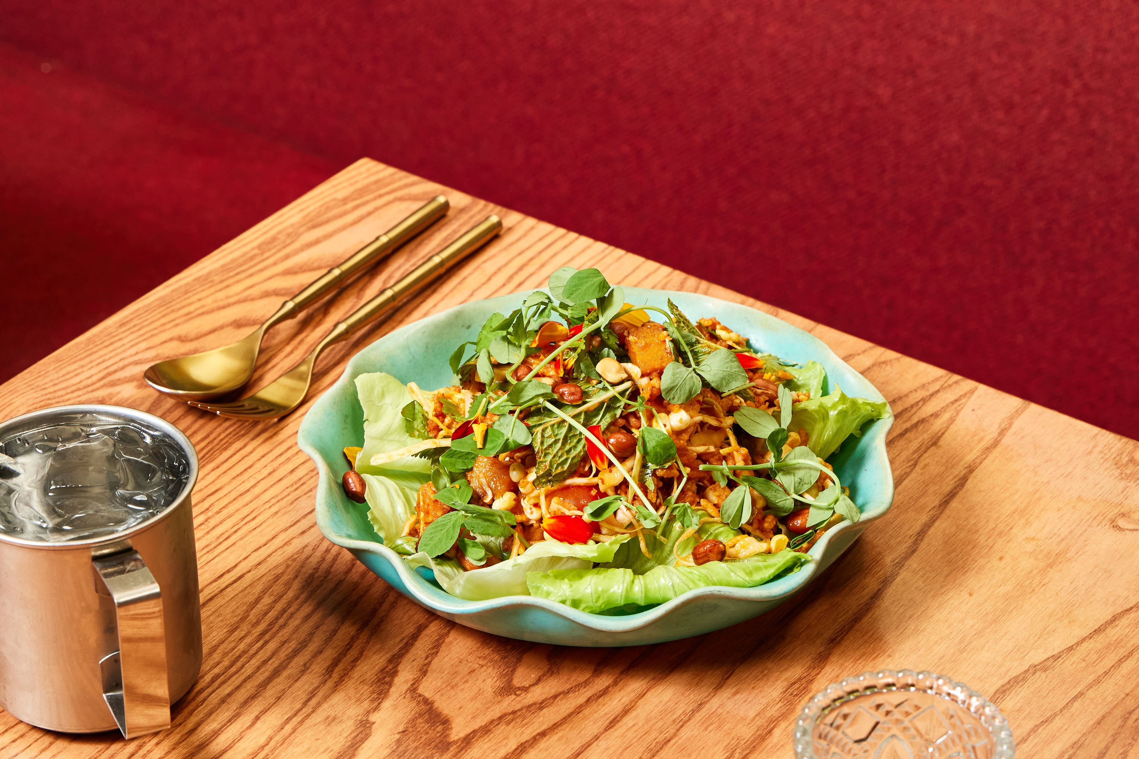Talat Market adds a Thai twist to dishes, like this Crispy Rice Salad, that tend to be uniform at other restaurants. (Bailey Garrot for the AJC)