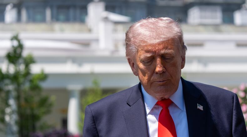 President Donald Trump speaks with reporters before departing on Marine One from the South Lawn of the White House, Friday, May 1, 2026, in Washington. (AP Photo/Alex Brandon)