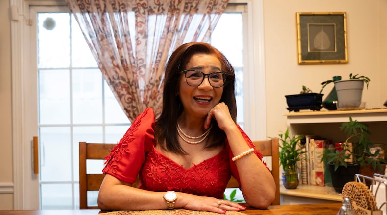 Jane Rolen poses in traditional Filipiniana in her home in East Point, Georgia on Monday, Nov. 20, 2023. Outside of her normal 9-5 job, Jane organizes several events for Filipino American History Month each October and serves as President of Philippine American Chamber of Commerce Georgia (PACCGA). She also hosts a podcast catering to Filipinos living in Georgia, one of the largest AAPI communities. (Olivia Bowdoin for the Atlanta-Journal Constitution).
