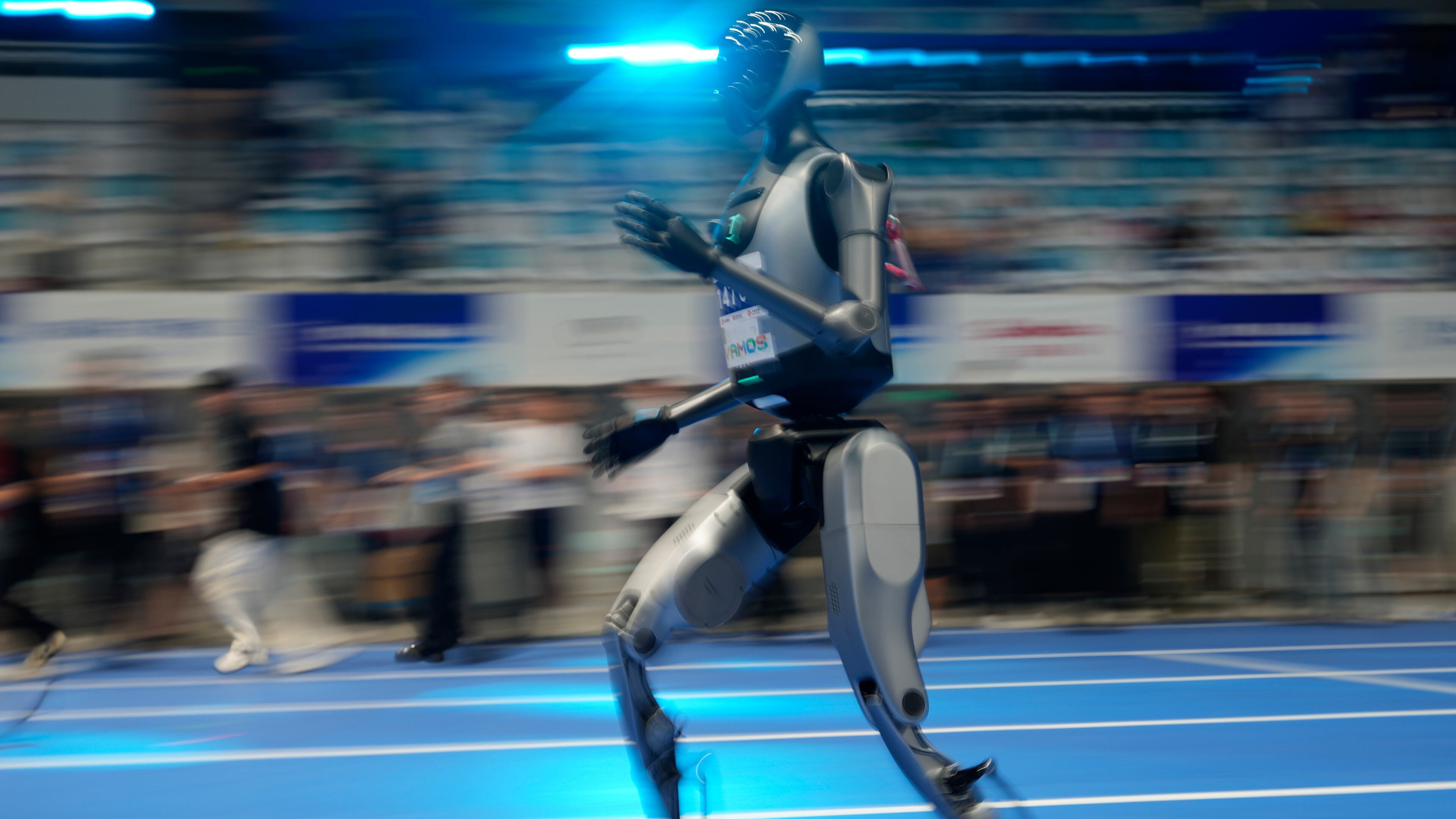 A robot rehearses the 100m race before the opening ceremony of The World Humanoid Robot Games held in Beijing, China, Thursday, Aug. 14, 2025. (AP Photo/Ng Han Guan)