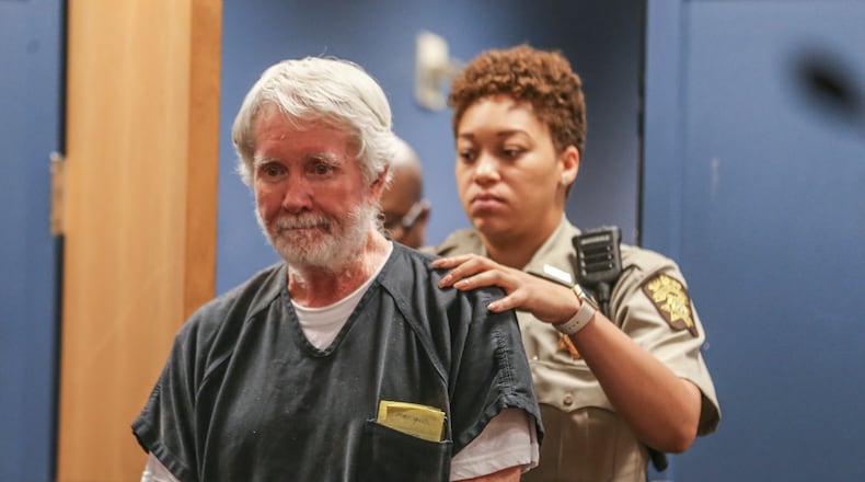 June 6, 2017 Atlanta:  Fulton County deputy, K. Jackson brings Claud "Tex" McIver into the courtroom. Atlanta attorney, Claud "Tex" McIver was arraigned for murder on Tuesday, June 6, 2017. McIver appeared before judge Robert McBurney. McIver shot his wife Diane as they rode in their SUV in midtown Atlanta in the fall of 2016. McIver has said it was an accident and initially faced involuntary manslaughter charges. A grand jury indicted him for murder in April. A judge revoked his bond after officers found a gun in his home. Judge McBurney is reviewing material presented at today’s hearing to determine whether bond will be granted. JOHN SPINK/JSPINK@AJC.COM.