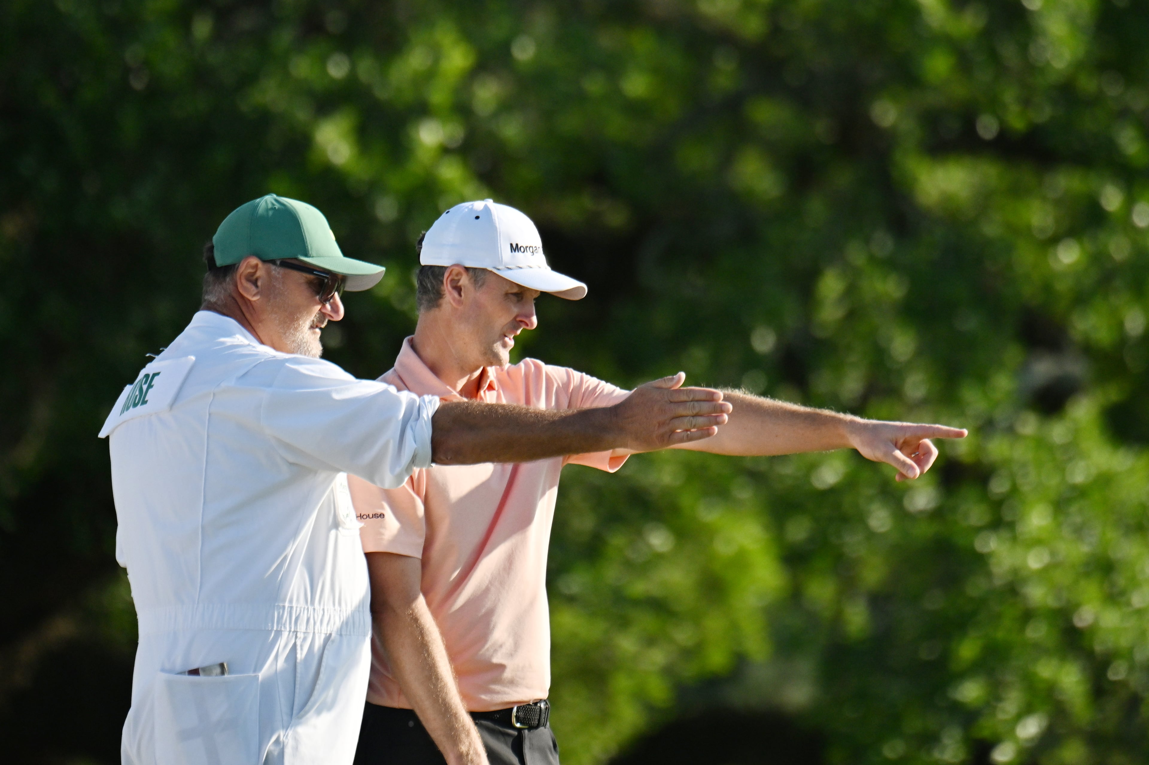 Justin Rose with caddie Mark Fulcher on 18th hole during final round of the Masters golf tournament, at Augusta National Golf Club, Sunday, April 13, 2025, in Augusta, Ga. (Hyosub Shin / AJC)
