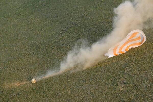 The Soyuz MS-26 spacecraft lands in a remote area near the town of Zhezkazgan, Kazakhstan, with NASA astronaut Don Pettit and Roscosmos cosmonauts Alexey Ovchinin and Ivan Vagner aboard, Sunday, April 20, 2025. (Bill Ingalls/NASA via AP)