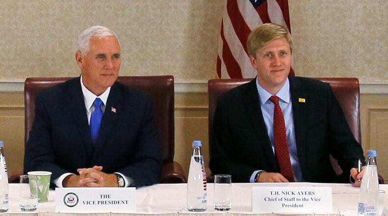 In this Aug. 1, 2017 file photo, Vice President Mike Pence, left, attends a meeting with Georgia opposition leaders in Tbilisi, Georgia. Chief of Staff to the Vice President, Nick Ayers, is right. Zurab Kurtsikidze/Pool Photo via AP
