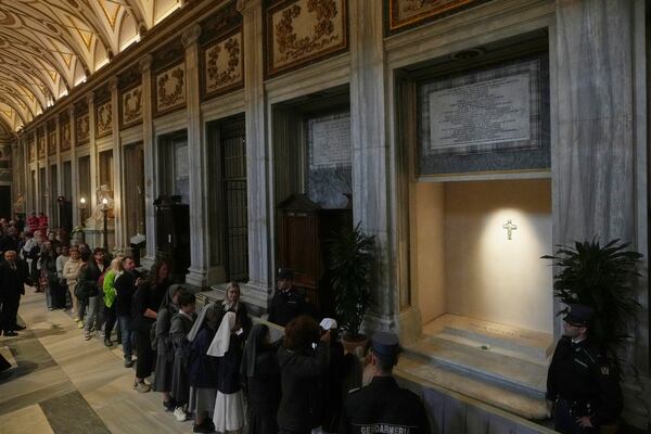 Faithful line up to pay their respects to the tomb of Pope Francis inside St. Mary Major Basilica in Rome, Sunday, April 27, 2025. (AP Photo/Alessandra Tarantino)