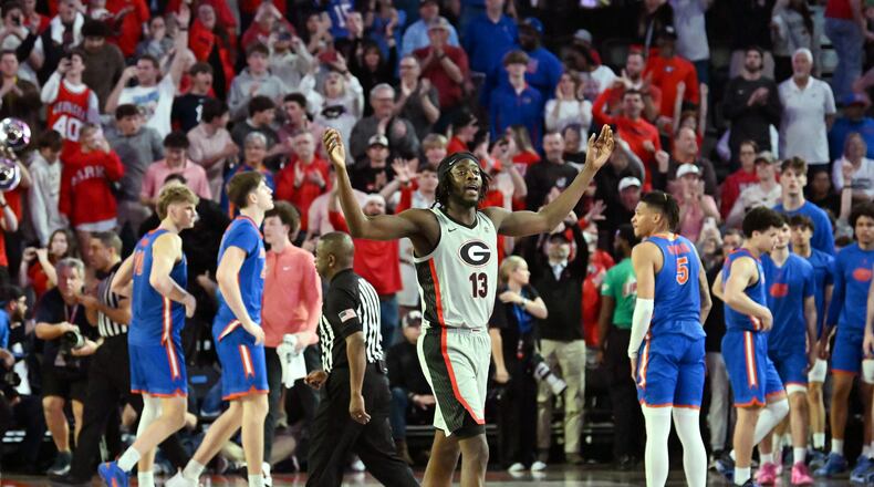 Georgia forward Dylan James (13) celebrates at the end of the second half of an NCAA college basketball game at Stegeman Coliseum, Tuesday, February 25, 2025, in Athens. against the Georgia won 88-83 over Florida. (Hyosub Shin / AJC)
