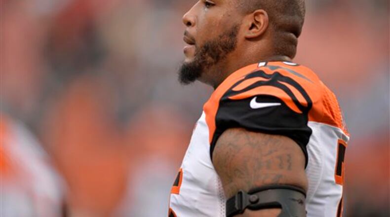 Cincinnati Bengals defensive tackle Devon Still walks on the field during warmups before an NFL football game against the Cleveland Browns Sunday, Dec. 14, 2014, in Cleveland. Cincinnati won 30-0. (AP Photo/David Richard)