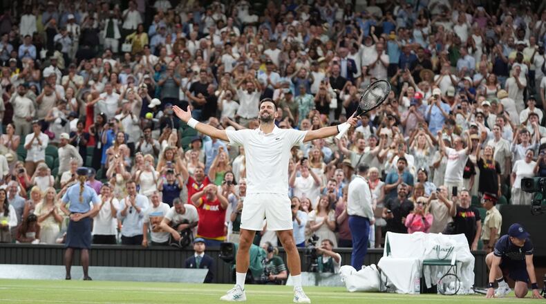 Novak Djokovic of Serbia celebrates winning against Felix Auger-Aliassime of Canada in their quarter-final men's singles match at the Wimbledon Tennis Championships in London, Tuesday, July 7, 2026. (AP Photo/Maja Smiejkowska)