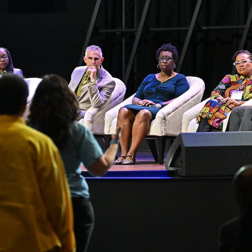 DeKalb County school administrators listen during a public comment session during a community meeting to discuss possible DeKalb school closures on Tuesday, April 28, 2026, at New Life Church in Decatur. (Hyosub Shin/AJC)