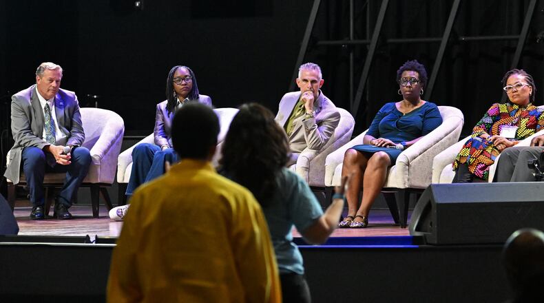 DeKalb County school administrators listen during a public comment session during a community meeting to discuss possible DeKalb school closures on Tuesday, April 28, 2026, at New Life Church in Decatur. (Hyosub Shin/AJC)