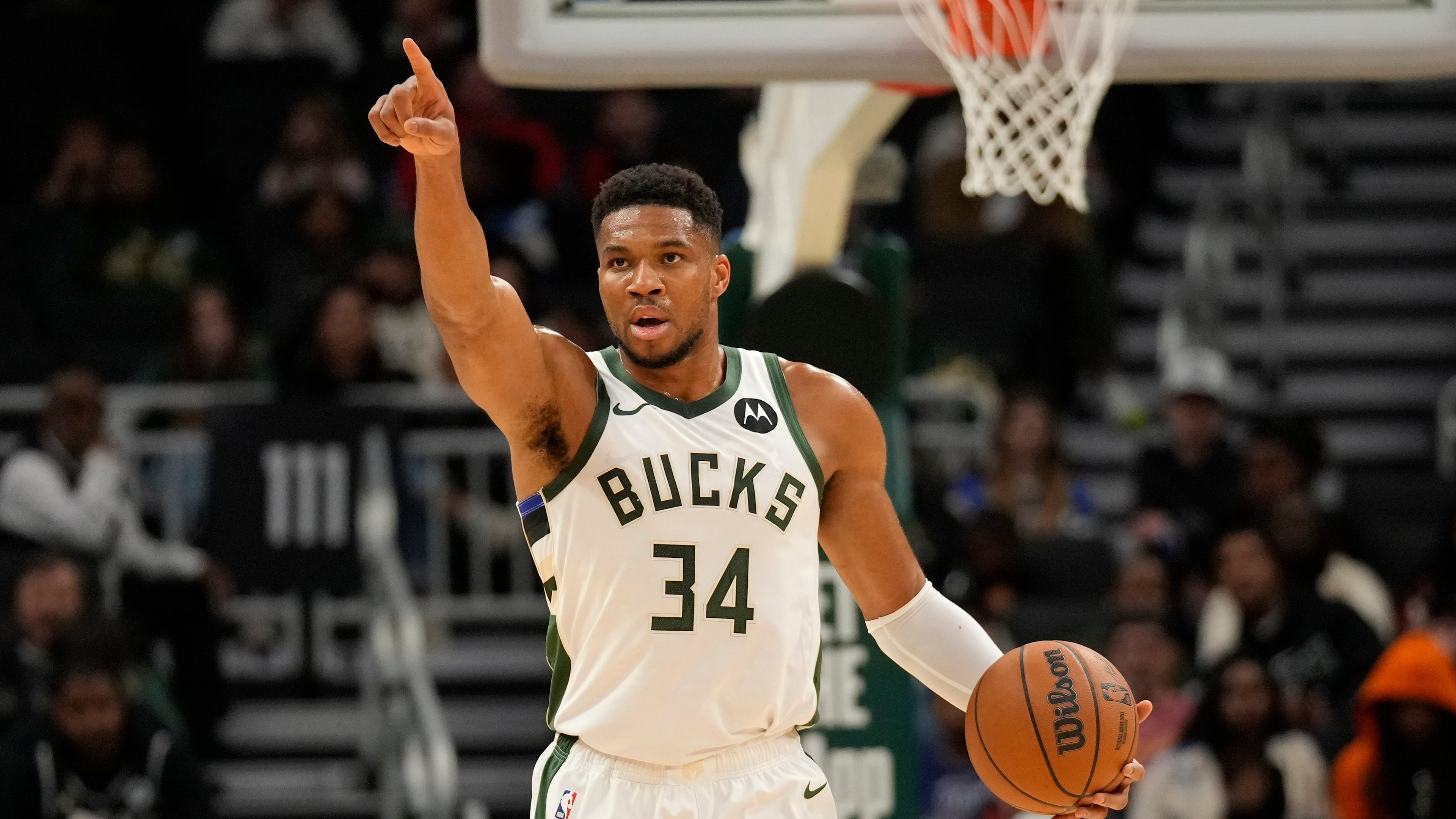 Milwaukee Bucks forward Giannis Antetokounmpo calls a play during the first half of a preseason NBA basketball game against the Oklahoma City Thunder on Tuesday, Oct. 14, 2025, in Milwaukee. (AP Photo/Kayla Wolf)