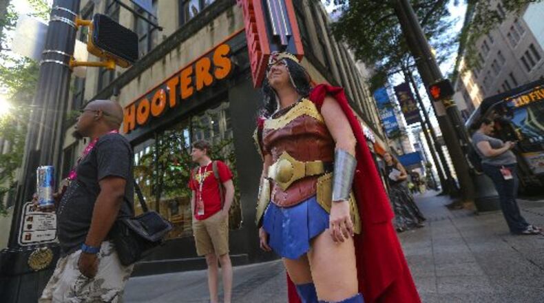 Rebecca Camp of Cartersville attended her fifth Dragon Con over the holiday weekend. Outfitted as Wonder Woman, she walked along Peachtree Street Friday, presumably not having to go far to convene with other superheroes. JOHN SPINK / JSPINK@AJC.COM