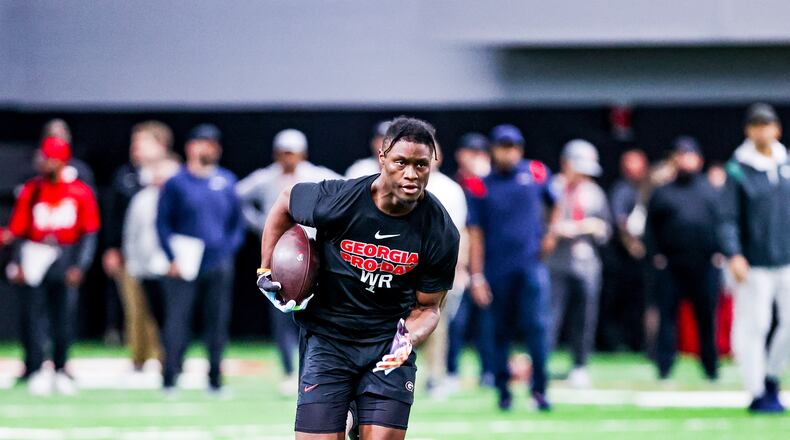 Former Georgia receiver George Pickens turns upfield after catching a pass from quarterback Carson Beck during his workout for NFL scouts at UGA Pro Day on Wednesday in the Payne Indoor Athletic Facility in Athens. (Photo by Tony Walsh/UGA Athletics)