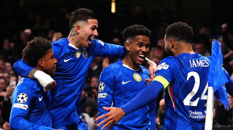 Chelsea's Estevao, second right, celebrates with his teammates after scoring his side's second goal during the Champions League opening phase soccer match between Chelsea and Barcelona in London, England, Tuesday, Nov. 25, 2025. (Bradley Collyer/PA via AP)