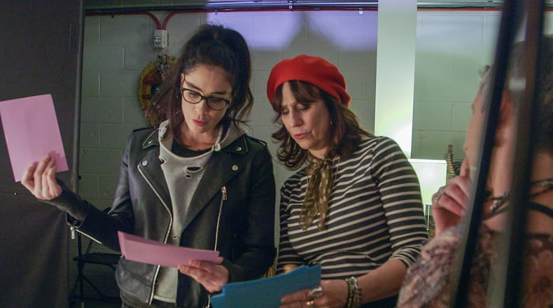 Lizz Winstead (right) works with fellow comedian Sarah Silverman in the documentary "No One Asked You." The film captures a traveling crew of abortion rights activists performing their comic road show in support of abortion clinic workers and caregivers. (Courtesy of Ruthless Films)