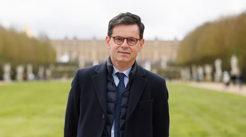 FILE Christophe Leribault, head of the Charteau de Versailles, poses March 29, 2024 in the park of the Chateau de Versailles, west of Paris. (AP Photo/Thomas Padilla, File)