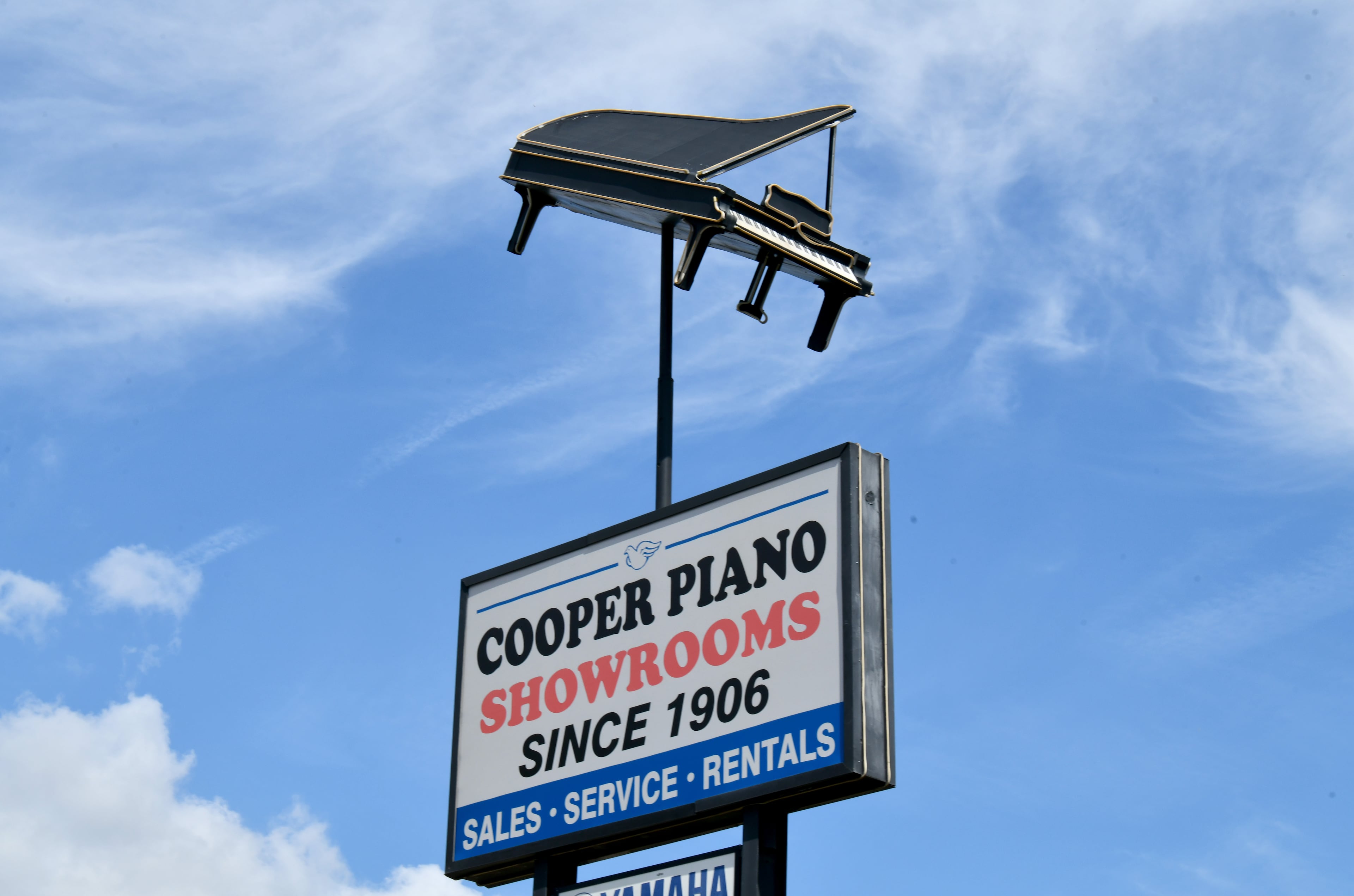 Cooper Piano plans to remove the grand piano from its sign by the end of October. (Hyosub Shin / AJC)