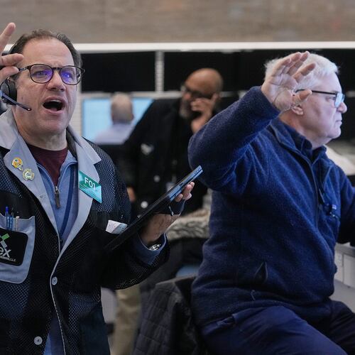 Anthony Spina, left, works with fellow options traders on the floor of the New York Stock Exchange, Wednesday, Jan. 28, 2026. (AP Photo/Richard Drew)