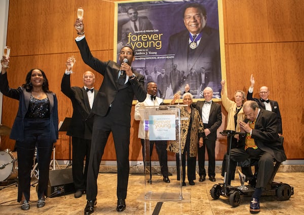 All living Atlanta Mayors honored Andrew Young, front right, including current Mayor Andre Dickens, front left, toasting Young with Mayors Keisha Lance Bottoms, from left back, Bill Campbell, Kasim Reed and Shirley Franklin. 