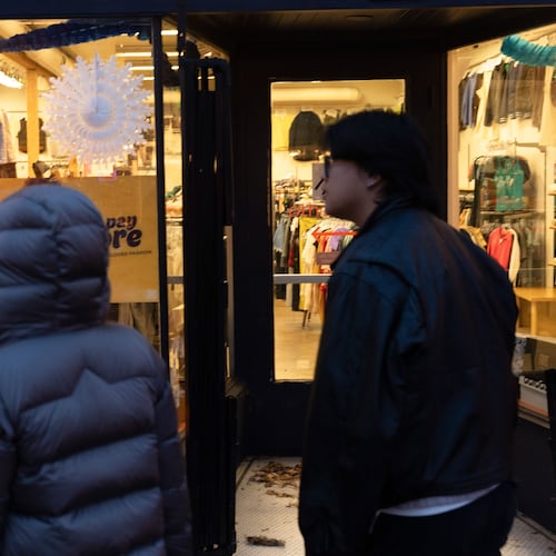 People walk by a shop on Tuesday, Jan. 6, 2026, in Portland, Ore. (AP Photo/Jenny Kane)
