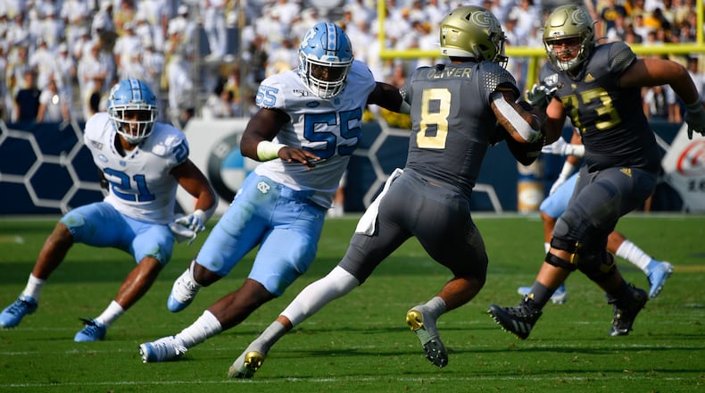 Georgia Tech quarterback Tobias Oliver (8) returns a punt during the first half of an NCAA college football game against North Carolina, Saturday, Oct. 5, 2019, in Atlanta. (Special-John Amis)