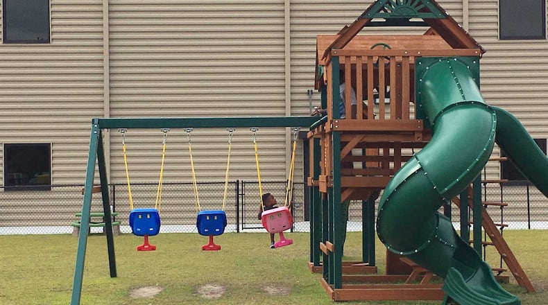 Tifden, 3, swings outside Crosspointe Church in Valdosta, which the Red Cross is using as a shelter for Hurricane Irma evacuees. His 28-year-old mother Tiffany Armstrong left Darien with other relatives and slept overnight Friday at the church.